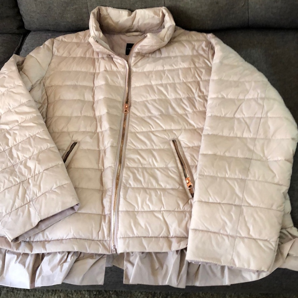 Light pale mauve puffer with rose gold zippers with ruffle about the bottom.